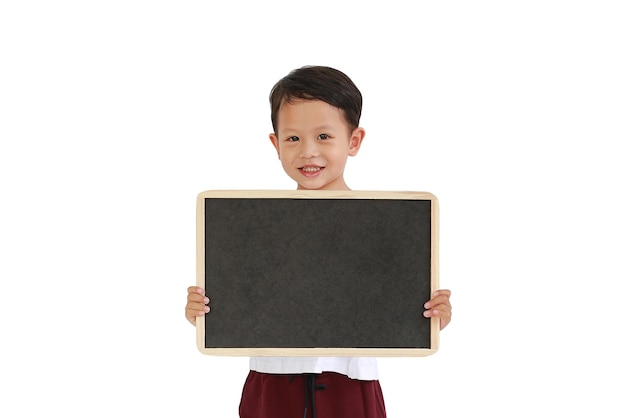 Adorable Asian little boy holding blank blackboard isolated on white background Education concept