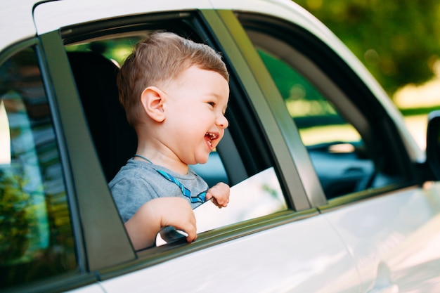 Adorable baby boy in the car