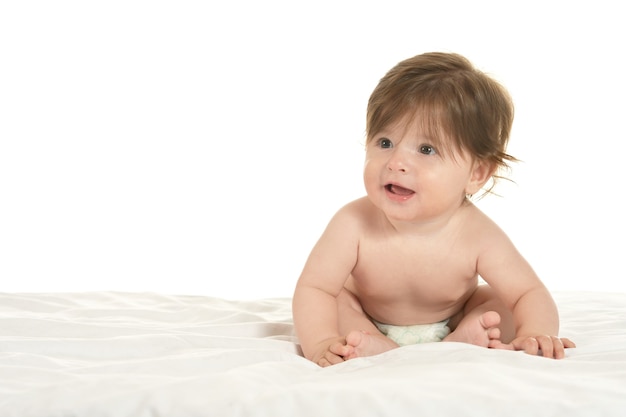 Adorable baby girl  on a blanket on a white background