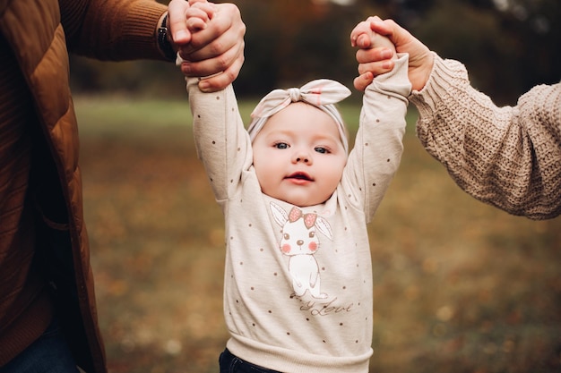 Adorable baby girl in headband with bow and bunny on jersey