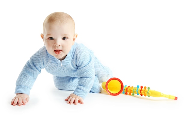 Adorable baby with plastic colourful saxophone isolated on white background