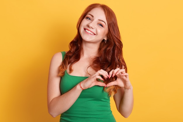 Adorable Caucasian woman in green t shirt