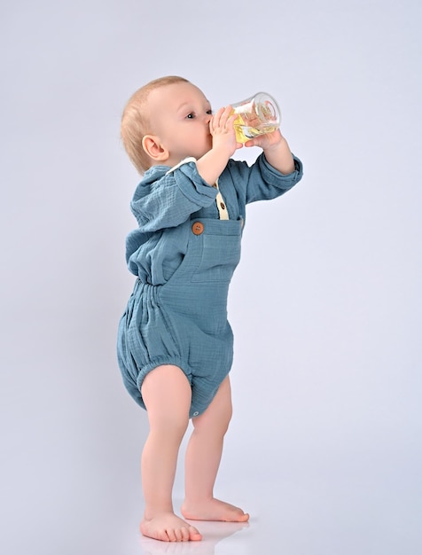 Adorable child drinking from bottle