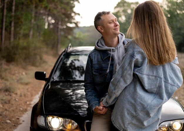 Adorable couple enjoying road trip together