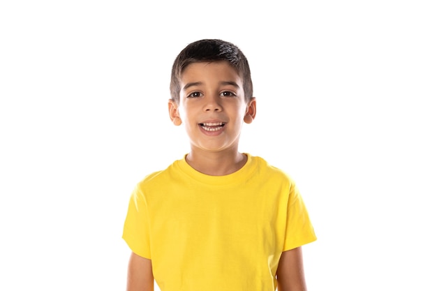 Adorable latin boy weraring a yellow t-shirt isolated on a white background