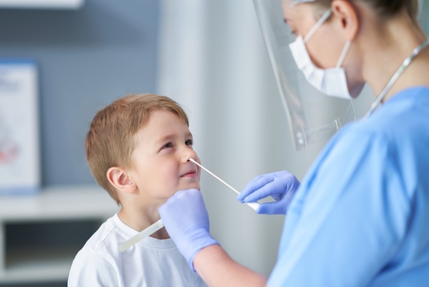 adorable little boy having doctor's appointment