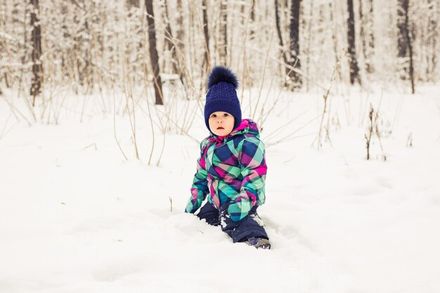 Adorable little girl having fun on winter day.