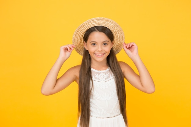 Adorable little girl wearing elegant hat Have funny summer holiday Summer tour Leisure and entertainment concept Summer happiness Vacation mood Tropical tour Sale and discount Goods for kids