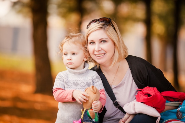 Adorable little girl with beautiful mother