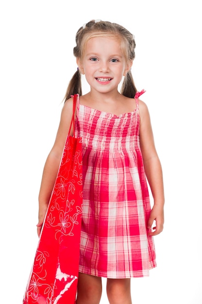 Adorable little girl with shopping bag