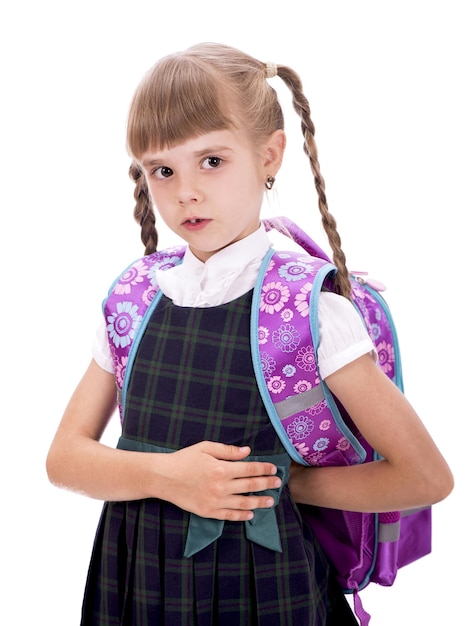 Adorable little schoolgirl with happy smile keeping arms crossed Small schoolgirl looking nice in school uniform Cute schoolgirl with long brunette hair and charming look