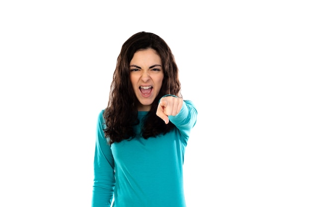 Adorable teenage girl with blue sweater isolated on a white wall