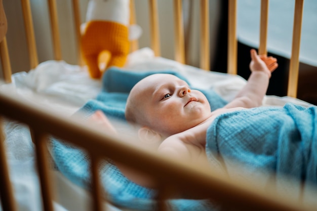 Adorable toddler baby boy with blue eye Copy space