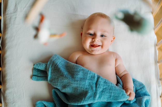 Adorable toddler playing on changing table for a baby sea aesthetics high quality photo