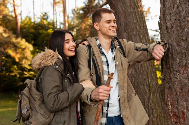 Adorable young couple enjoying walk in the nature