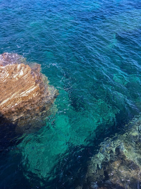 Adriatic blue sea with coastal cliffs on a sunny day Montenegro