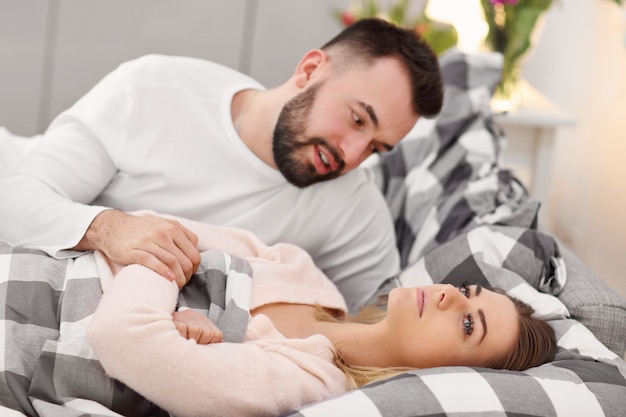 adult attractive couple in bed