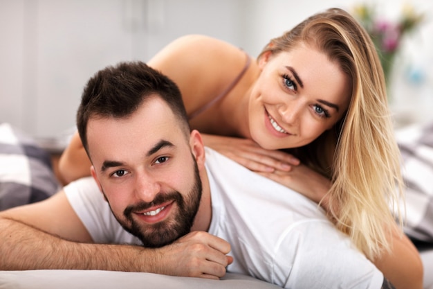 adult attractive couple in bed