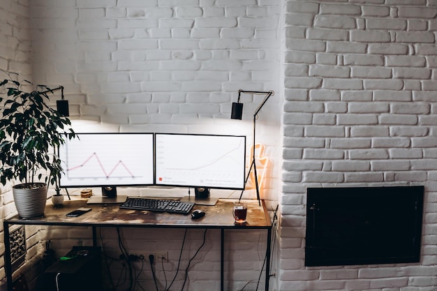 Adult bearded man working sitting at home desk at computer working online