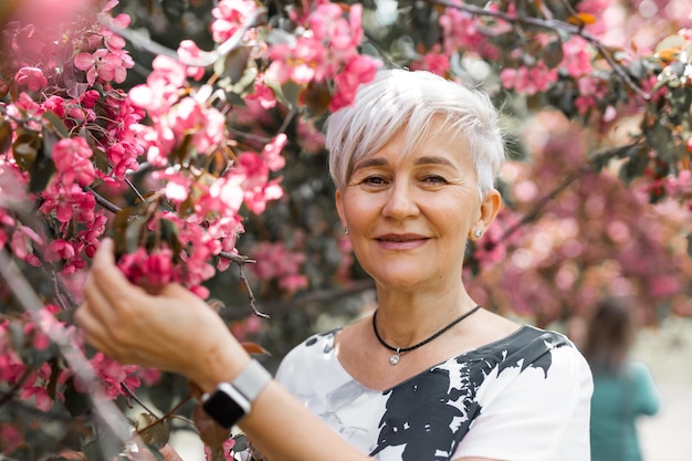 adult beautiful woman in flowering trees