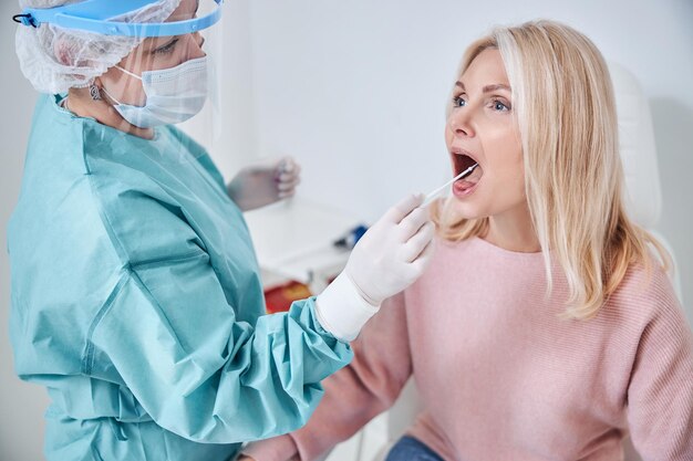 Adult female patient being tested for coronavirus