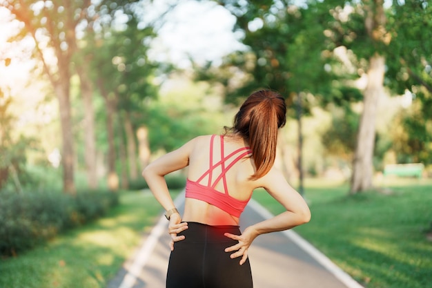 Adult female with her muscle pain during running runner woman having back and Waist body ache due to Piriformis Syndrome Low Back Pain and Spinal Compression Sports injuries and medical concept