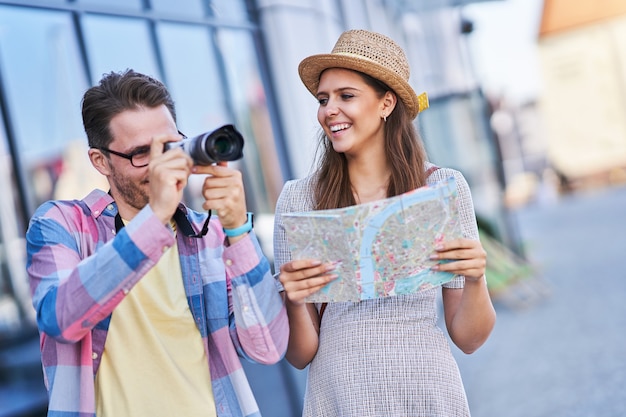 adult happy tourists sightseeing Gdansk Poland in summer