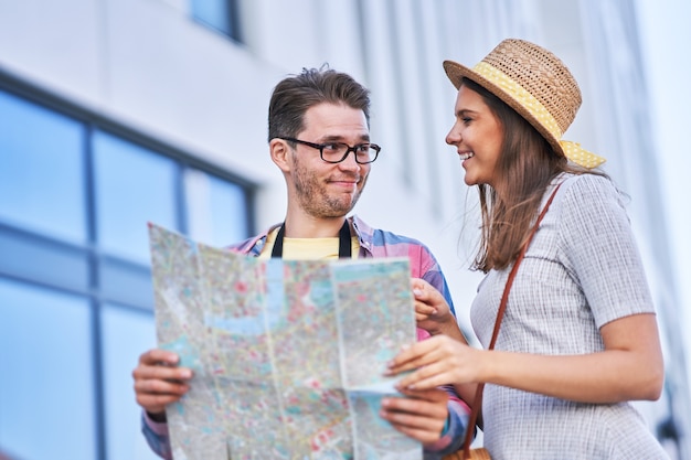 adult happy tourists sightseeing Gdansk Poland in summer