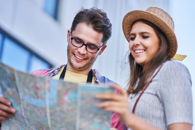 adult happy tourists sightseeing Gdansk Poland in summer