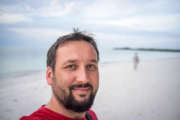 Adult man portrait on tropical beach