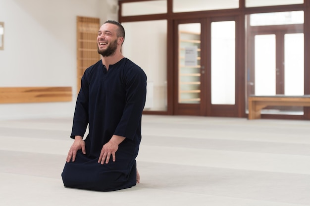 Adult Muslim Man Is Praying In The Mosque