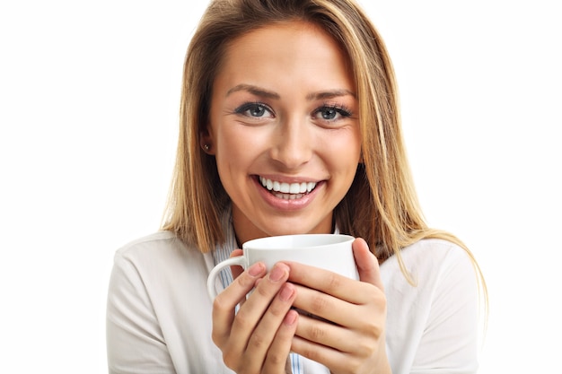 adult woman drinking cup of tea coffee isolated over white