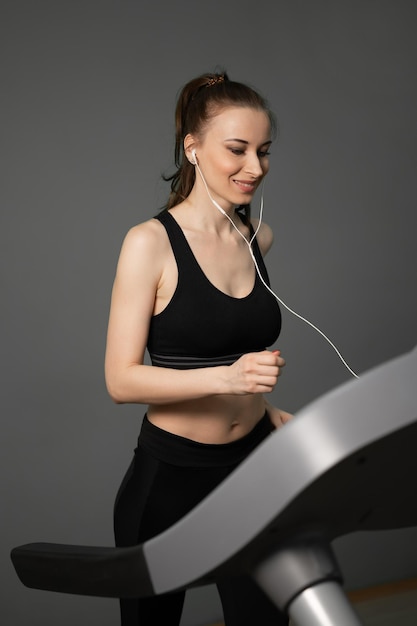 Adult woman running on treadmill