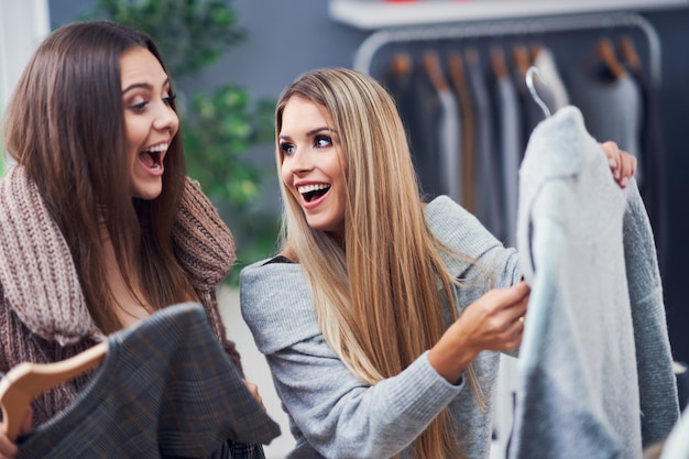 adult woman shopping for clothes in the city center in autumn