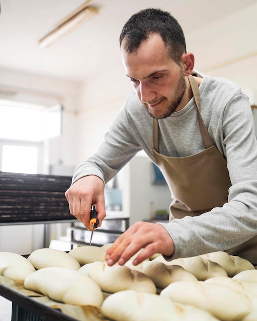 Adult working on delicious fresh breads