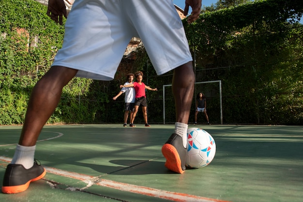 Adults playing soccer