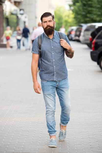 Adventure is out there. Mature hipster with beard. Bearded man. Confident brutal man walk street. Male hair barber care. brutal caucasian hipster with moustache. adventure concept. urban style.