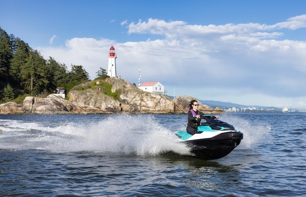 Adventurous caucasian woman on seadoo riding in the ocean