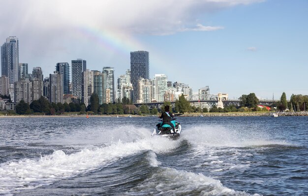 Adventurous caucasian woman on water scooter riding in the ocean