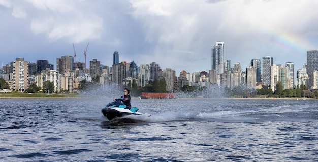 Adventurous caucasian woman on water scooter riding in the ocean