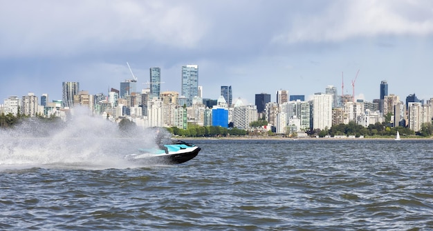 Adventurous Caucasian Woman on Water Scooter riding in the Ocean