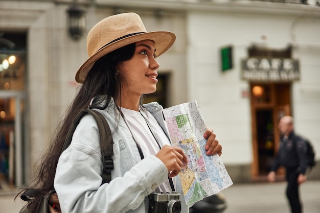 Adventurous Latina tourist explores new city with camera