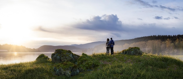 Adventurous Man and Woman Couple Standing in Nature