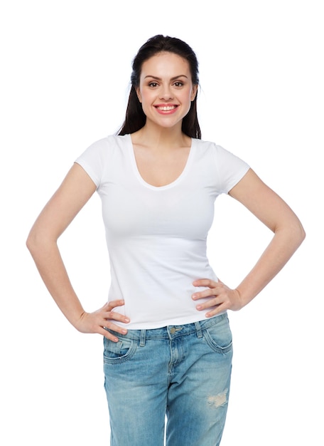 advertisement, clothing and people concept - happy smiling young woman or teenage girl in white t-shirt