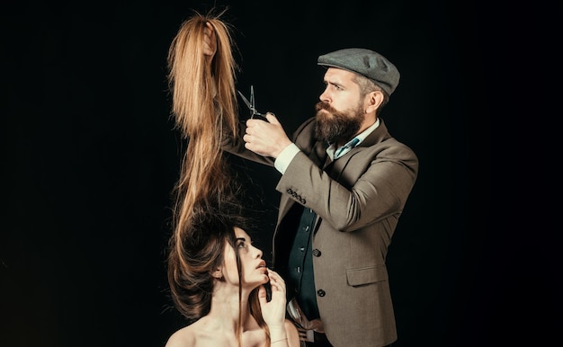 Advertising and barber shop concept hair stylist and barber woman getting haircut by hairdresser at