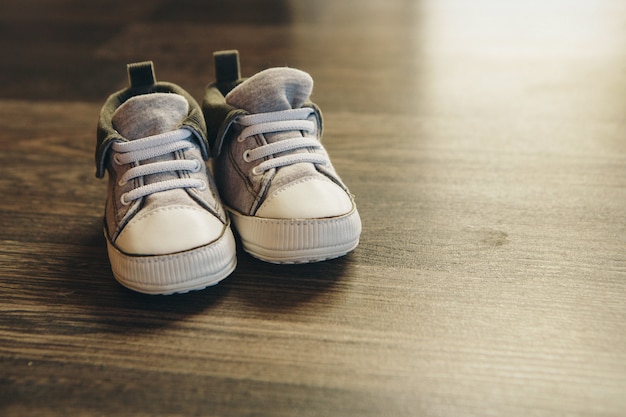 Advertising children's shoes: sneakers are on the floor