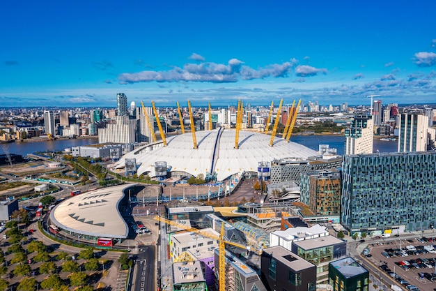 Aerial bird's eye view of the iconic O2 Arena near isle of Dogs and Emirates Air Line cable car in London, United Kingdom