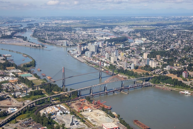 Aerial city view of Pattullo and Skytrain Bridge across the Fraser River