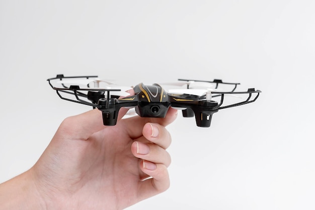 Aerial drone in hand on a white background.