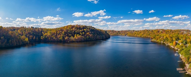 Aerial drone panorama of the autumn fall colors surrounding Cheat Lake over the interstate I68 bridge near Morgantown West Virginia